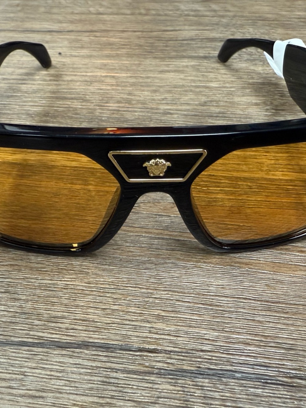 Versace Black Frame Sunglasses with Amber Lenses and Gold Medusa Accent